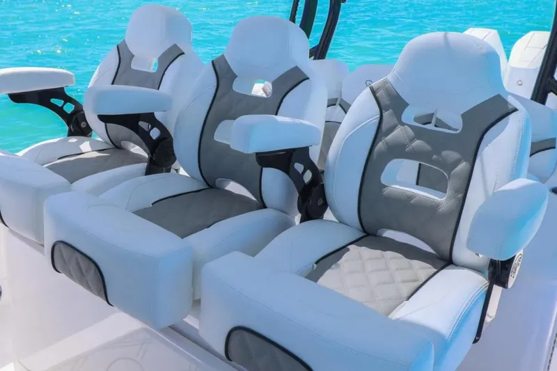 Slide: The Image of Luxurious seating on 2025 Blackwater 43 Luxury Fish boat, featuring plush white and gray upholstery. - 24