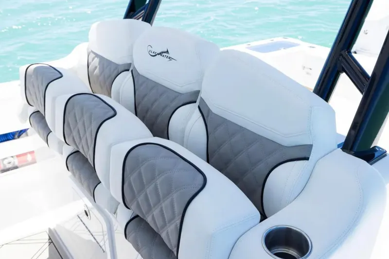 Slide: The Image of Luxurious seating on 2025 Blackwater 43 Luxury Fish boat with quilted design and cup holder. - 25