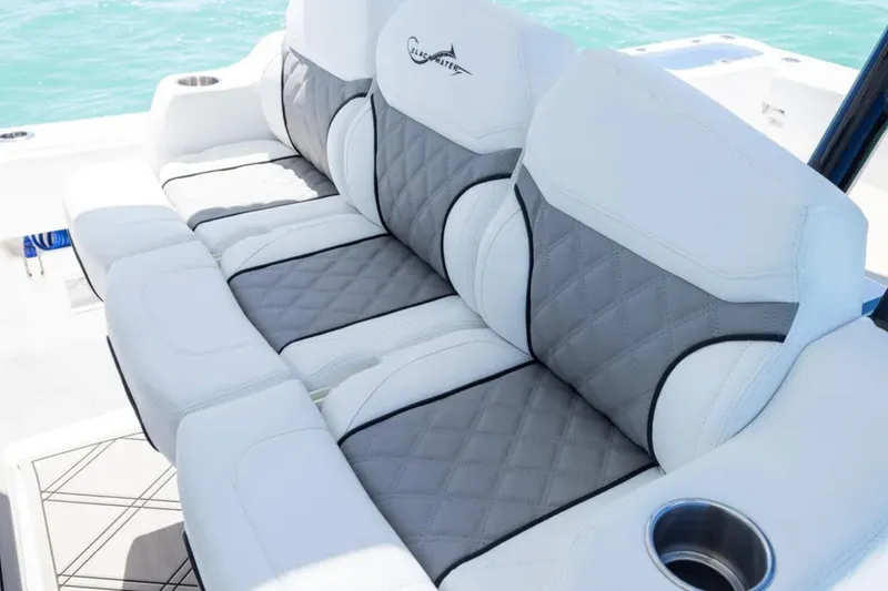 Slide: The Image of Luxurious seating on 2025 Blackwater 43 Luxury Fish boat, featuring quilted gray and white upholstery. - 26