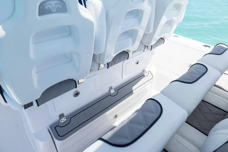Slide: The Image of Luxury seating on 2025 Blackwater 43 Luxury Fish boat, featuring white and gray cushioned design. - 27