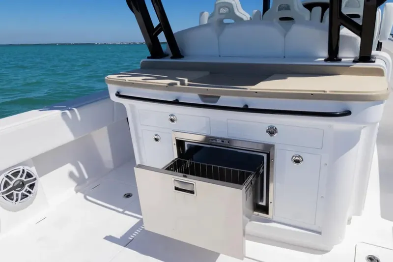 Slide: The Image of 2025 Blackwater 43 Luxury Fish boat interior with open storage compartment, ocean view. - 32