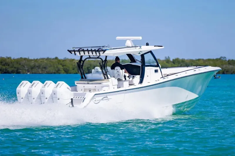 Slide: The Image of 2025 Blackwater 43 Luxury Fish boat cruising on clear blue water. - 4