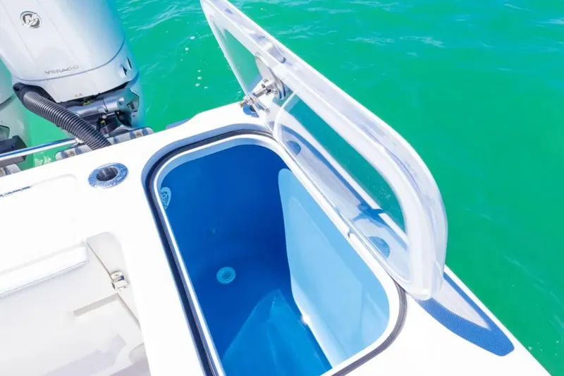 Slide: The Image of Open livewell on 2025 Blackwater 43 Luxury Fish boat, with clear blue water background. - 40