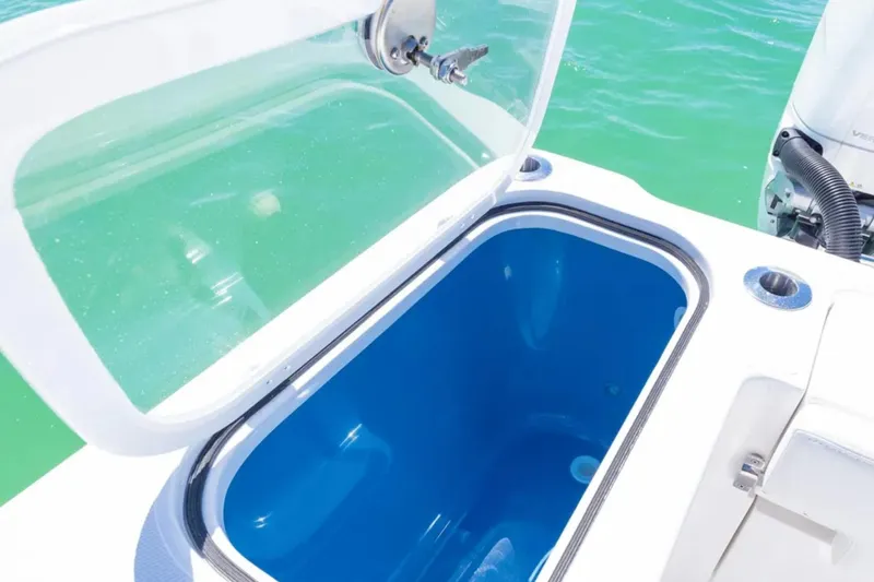 Slide: The Image of Open livewell on 2025 Blackwater 43 Luxury Fish boat, showcasing blue interior and clear lid. - 41