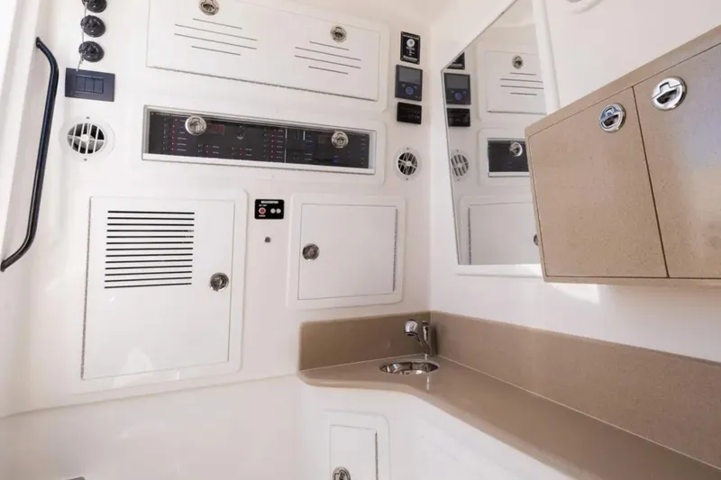 Slide: The Image of Interior of 2025 Blackwater 43 Luxury Fish boat, featuring control panels and storage cabinets. - 44