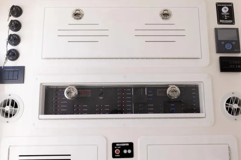 Slide: The Image of Control panel of 2025 Blackwater 43 Luxury Fish boat, featuring switches and gauges. - 48