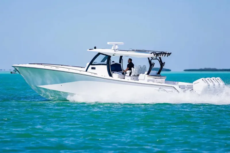 Slide: The Image of 2025 Blackwater 43 Luxury Fish boat cruising on turquoise water. - 5