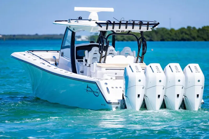 Slide: The Image of 2025 Blackwater 43 Luxury Fish boat with four powerful engines on turquoise water. - 6