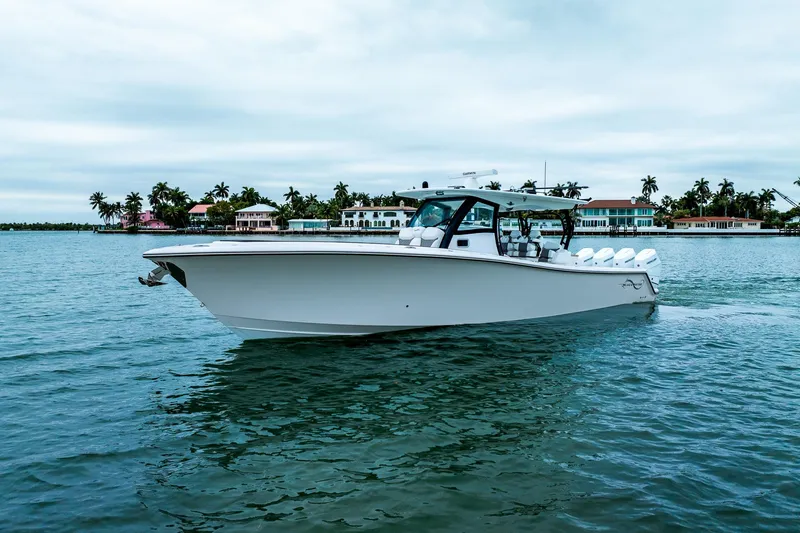 Slide: The Image of 2026 Blackwater 43 Luxury Fish boat cruising near tropical waterfront homes. - 65