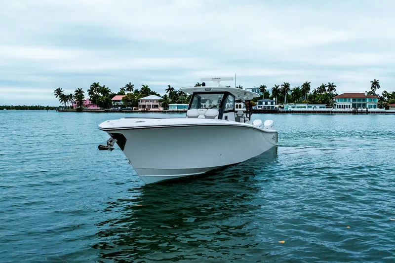 Slide: The Image of 2026 Blackwater 43 Luxury Fish boat cruising near waterfront homes. - 66