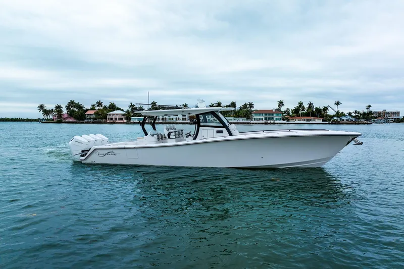 Slide: The Image of 2026 Blackwater 43 Luxury Fish boat cruising on calm waters near a tropical shoreline. - 68