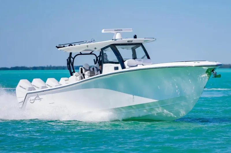Slide: The Image of 2025 Blackwater 43 Luxury Fish boat cruising on turquoise water. - 7