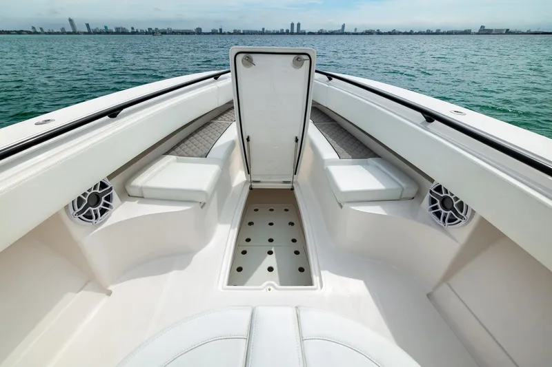 Slide: The Image of Bow seating area of 2026 Blackwater 43 Luxury Fish boat with city skyline view. - 80