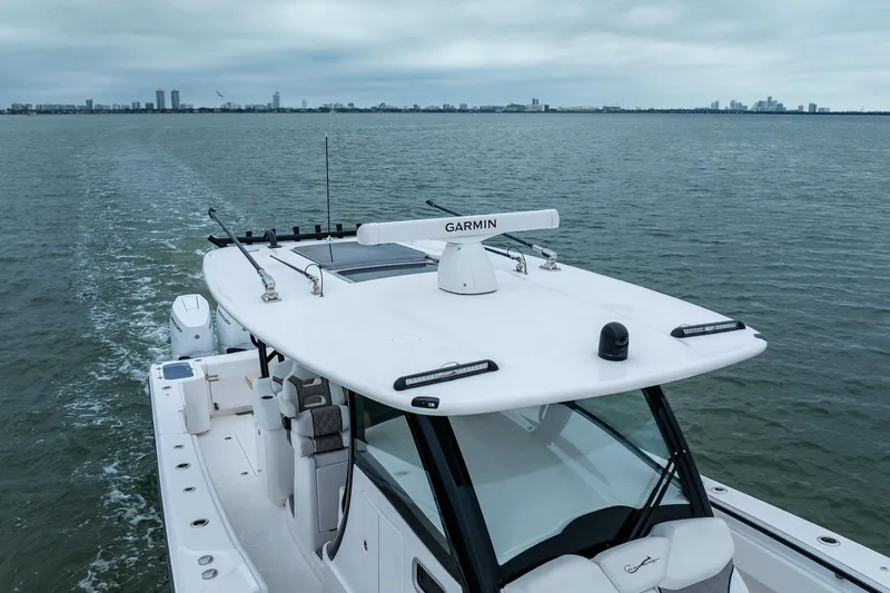 Slide: The Image of 2026 Blackwater 43 Luxury Fish boat cruising on open water with city skyline. - 83