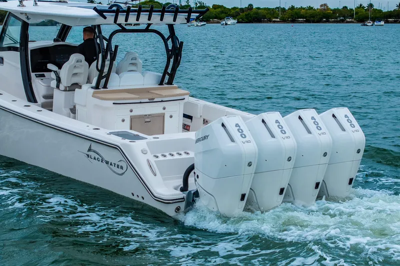 Slide: The Image of 2026 Blackwater 43 Luxury Fish boat with four Mercury 400 V10 engines on water. - 92