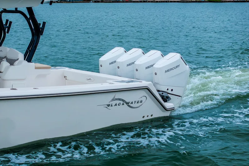 Slide: The Image of 2026 Blackwater 43 Luxury Fish boat with Mercury engines cruising on water. - 93