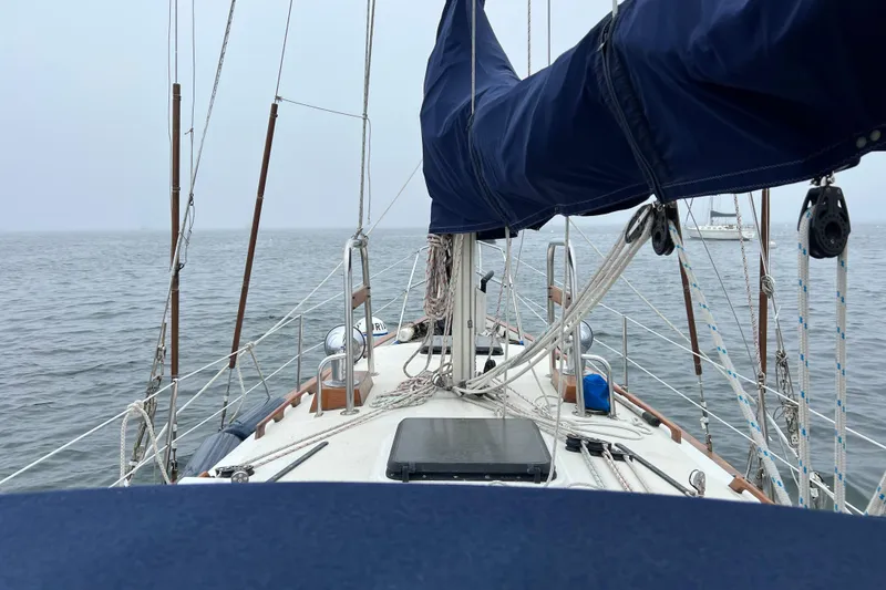 Slide: The Image of Sailing on a 1982 Pacific Seacraft 37 yacht, calm sea view. - 26