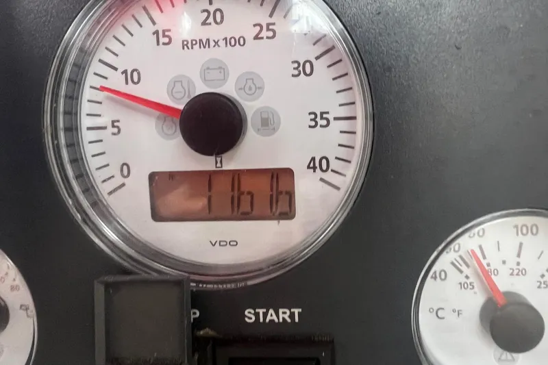 Slide: The Image of Tachometer and gauges of a 1982 Pacific Seacraft 37, showing RPM and temperature. - 49
