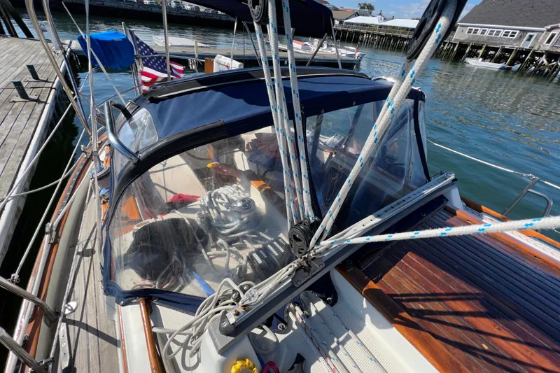 Slide: The Image of 1982 Pacific Seacraft 37 sailboat docked, featuring rigging and cockpit details. - 9