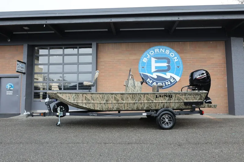 The Image of 2026 Lund 1870 Predator CC boat on trailer at Bjornson Marine dealership. - 0