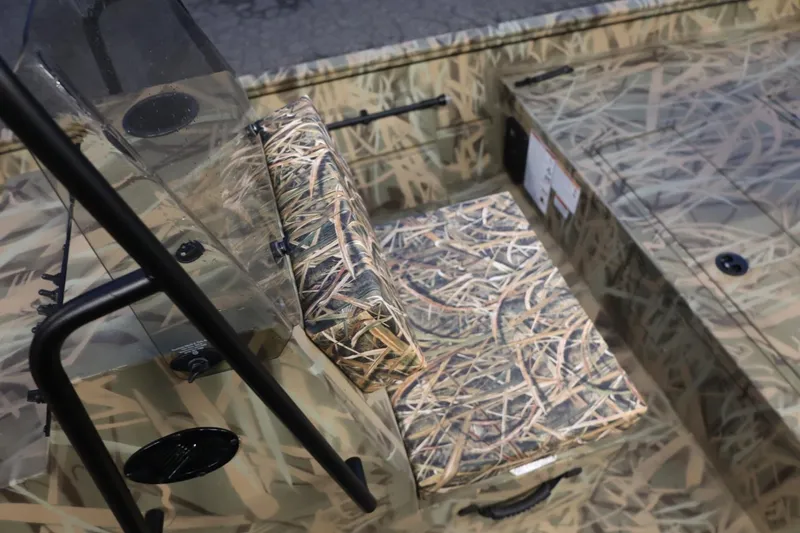 Slide: The Image of 2026 Lund 1870 Predator CC boat with camouflage seating and console design. - 10