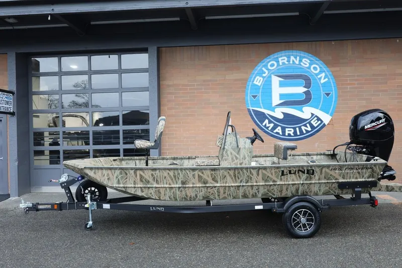 Slide: The Image of 2026 Lund 1870 Predator CC boat with camouflage design at Bjornson Marine. - 20