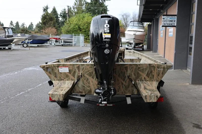 Slide: The Image of 2026 Lund 1870 Predator CC boat with camouflage design and 105 HP outboard motor. - 23