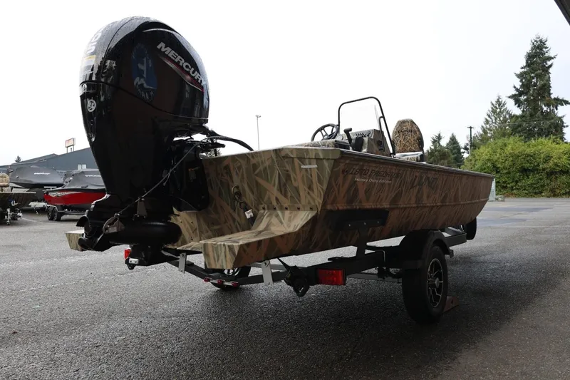 Slide: The Image of 2026 Lund 1870 Predator CC boat with Mercury outboard engine on trailer. - 32