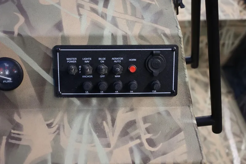 Slide: The Image of Control panel of 2026 Lund 1870 Predator CC boat with camouflage design. - 5