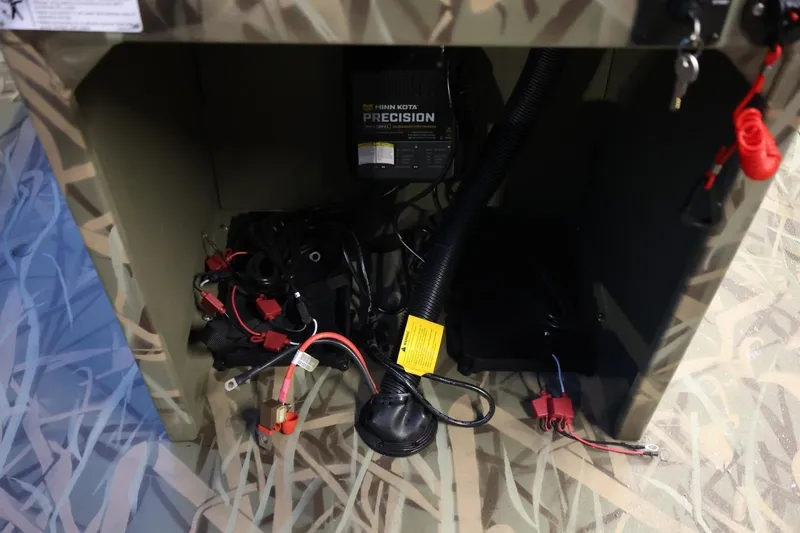 Slide: The Image of 2026 Lund 1870 Predator CC boat interior wiring and battery setup. - 7