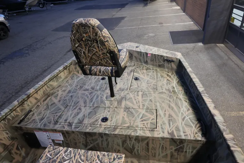 Slide: The Image of 2026 Lund 1870 Predator CC boat with camouflage seating and deck design. - 9