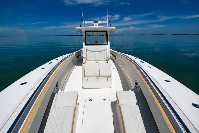Slide: The Image of 2024 Blackwater 43 Sportfish boat with luxurious seating on calm waters. - 11