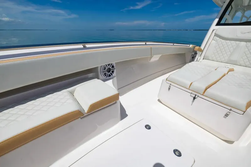 Slide: The Image of Luxurious seating on 2024 Blackwater 43 Sportfish boat, featuring elegant white and tan upholstery. - 13