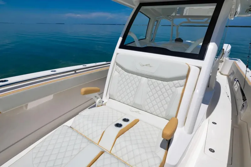 Slide: The Image of 2024 Blackwater 43 Sportfish boat with luxurious seating and sleek design on calm waters. - 15
