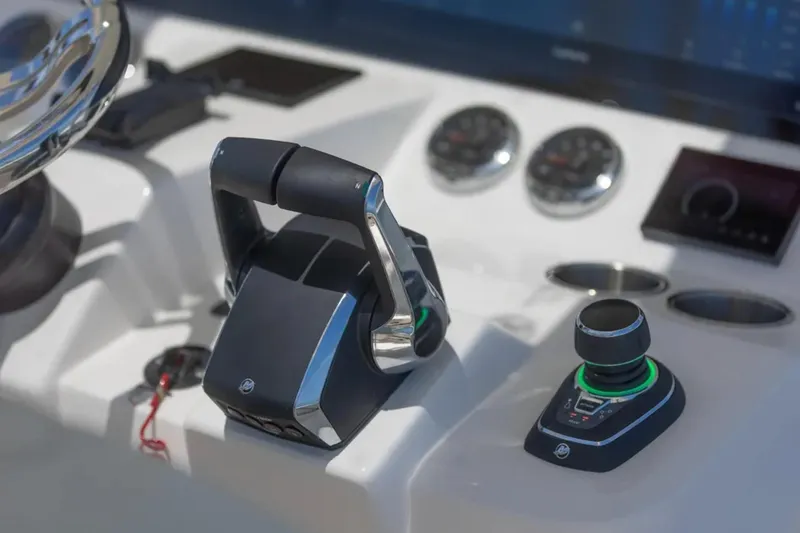 Slide: The Image of Control panel of 2024 Blackwater 43 Sportfish boat with throttle and joystick. - 26