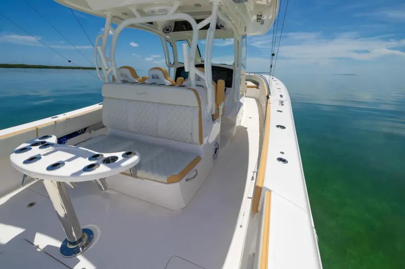 Slide: The Image of 2024 Blackwater 43 Sportfish boat on calm water, featuring luxurious seating and fishing amenities. - 32