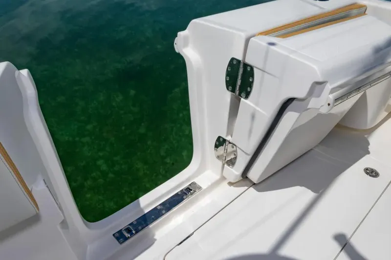 Slide: The Image of 2024 Blackwater 43 Sportfish boat with open side door, showing water access. - 33