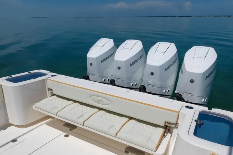 Slide: The Image of 2024 Blackwater 43 Sportfish boat with four Mercury outboard engines on calm water. - 39