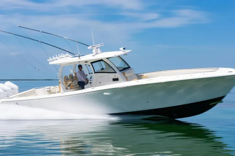 Slide: The Image of 2024 Blackwater 43 Sportfish boat cruising on clear blue water. - 4