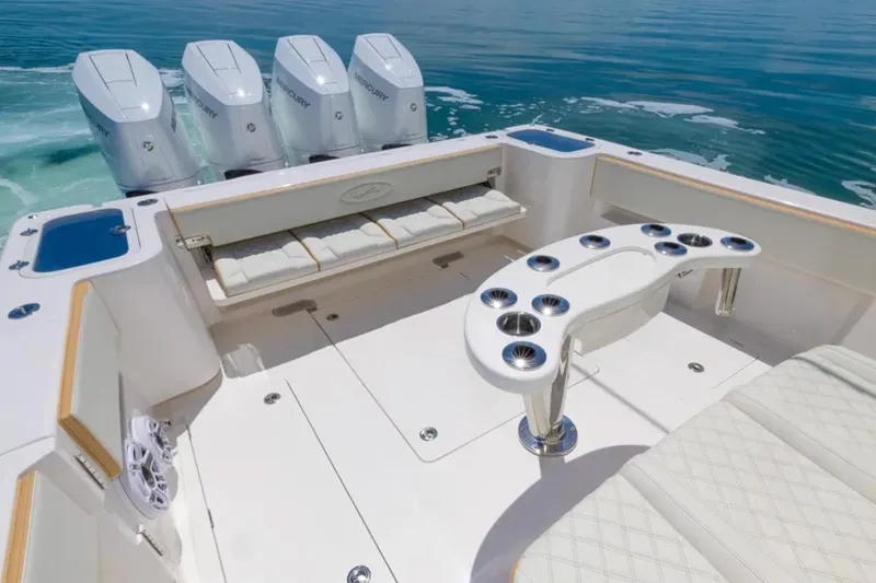 Slide: The Image of 2024 Blackwater 43 Sportfish boat deck with seating and multiple outboard engines. - 42