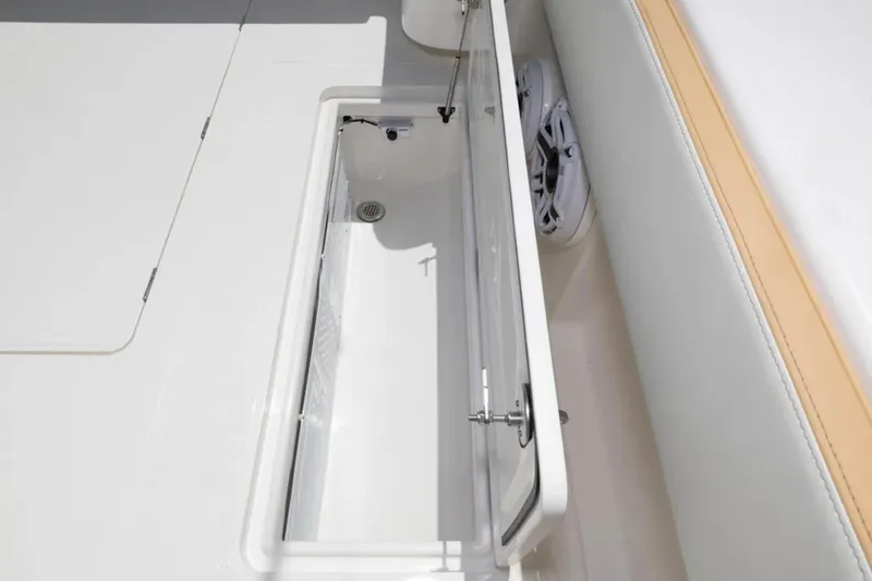 Slide: The Image of Open storage compartment on 2024 Blackwater 43 Sportfish boat deck. - 49