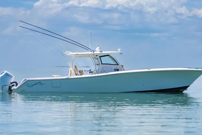 Slide: The Image of 2024 Blackwater 43 Sportfish boat on calm water under a cloudy sky. - 54