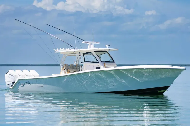 Slide: The Image of 2024 Blackwater 43 Sportfish boat on calm water under a clear sky. - 55