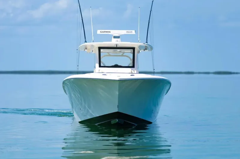 Slide: The Image of 2024 Blackwater 43 Sportfish boat on calm blue water, front view. - 56