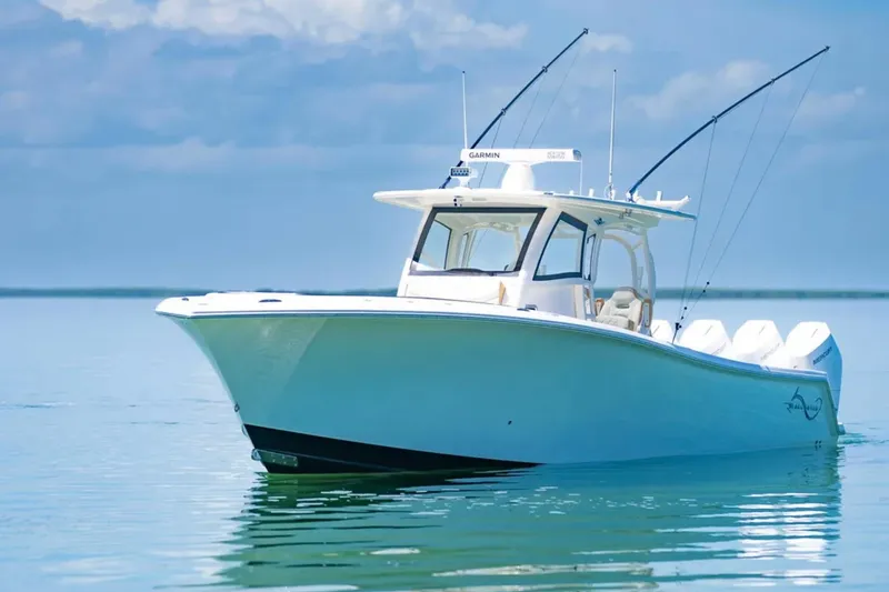 Slide: The Image of 2024 Blackwater 43 Sportfish boat on calm water under blue sky. - 57