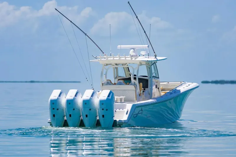Slide: The Image of 2024 Blackwater 43 Sportfish boat with four engines on calm water. - 6