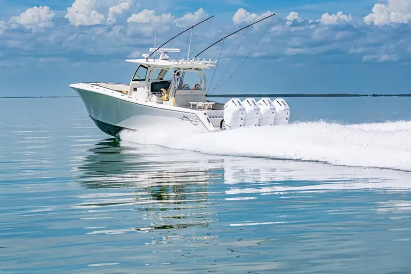 Slide: The Image of 2024 Blackwater 43 Sportfish boat cruising on calm ocean waters. - 64