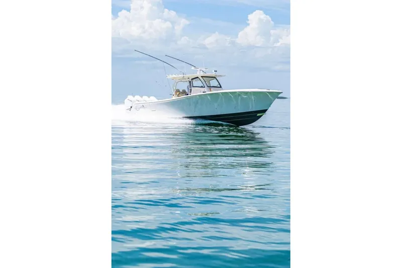 Slide: The Image of 2024 Blackwater 43 Sportfish boat cruising on calm ocean waters. - 65