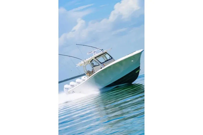 Slide: The Image of 2024 Blackwater 43 Sportfish boat cruising on open water under a clear sky. - 70