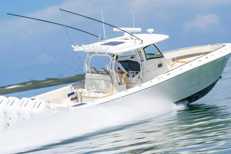 Slide: The Image of 2024 Blackwater 43 Sportfish boat cruising on open water, showcasing sleek design and powerful engines. - 72